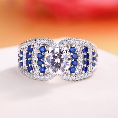 Round Cut White and Blue Sapphire Sterling Silver Engagement Ring