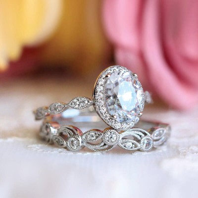 Vintage Oval Cut White Sapphire Sterling Silver Halo Bridal Sets