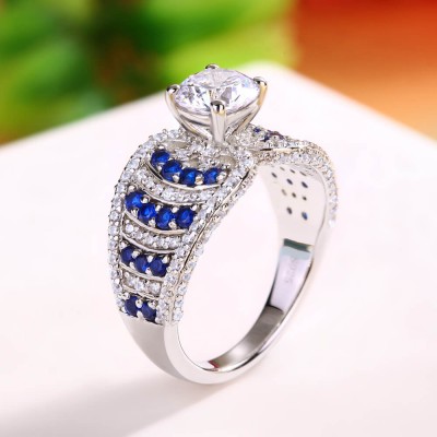 Round Cut White and Blue Sapphire Sterling Silver Engagement Ring