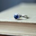 Round Cut Blue Sapphire Sterling Silver Twisted Halo Engagement Ring